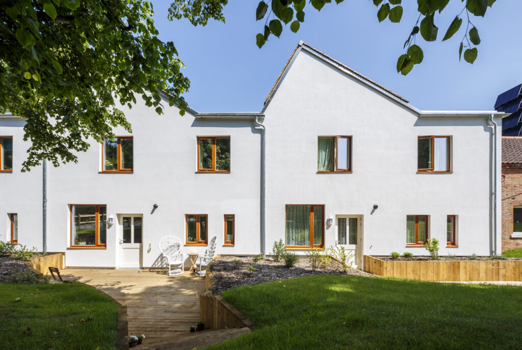 Outside view of Exhibition Mews, a multi-award winning terrace of three prototype carbon-neutral houses in Bordon, Hampshire designed by Ash Sakula Architects